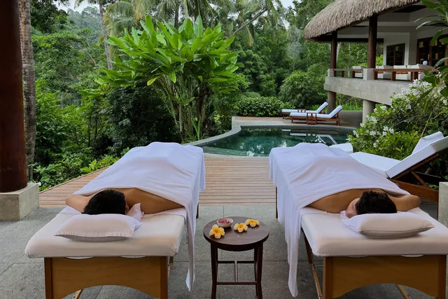 Couples massage on two tables side by side at a Bali villa