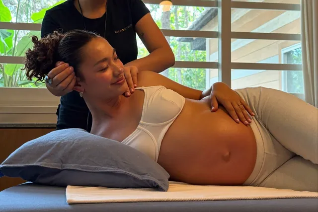 Gentle prenatal pregnancy massage with support pillows in Bali